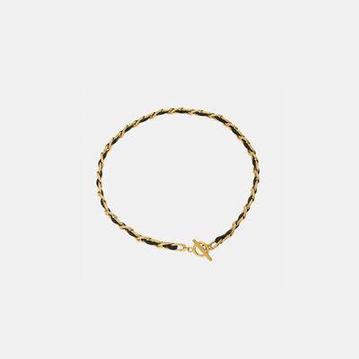 a gold bracelet with a letter on it