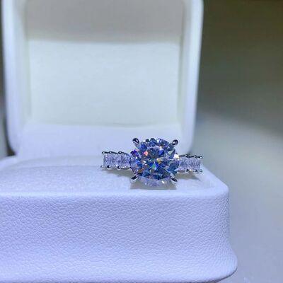 a blue and white diamond ring in a white box