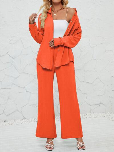 a woman in an orange suit posing for a picture