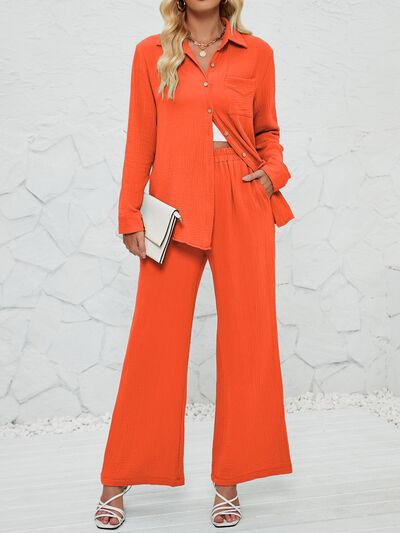 a woman in an orange shirt and wide legged pants
