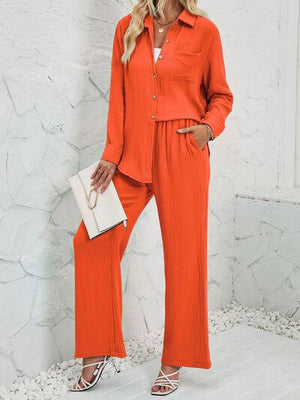 a woman in an orange jumpsuit posing for a picture