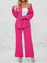 a woman in a pink suit posing for a picture