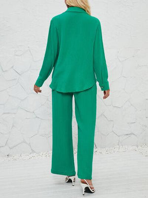 a woman in a green suit is walking