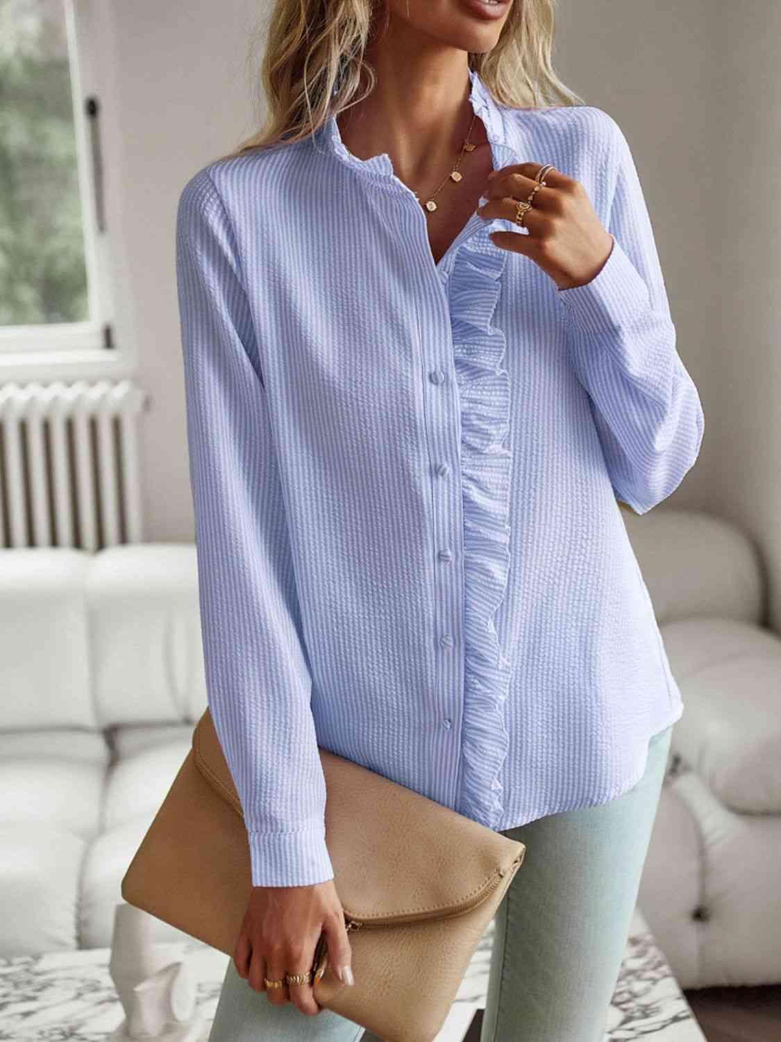 a woman wearing a blue shirt and jeans