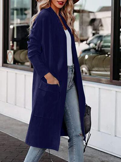 a woman wearing a blue coat and jeans