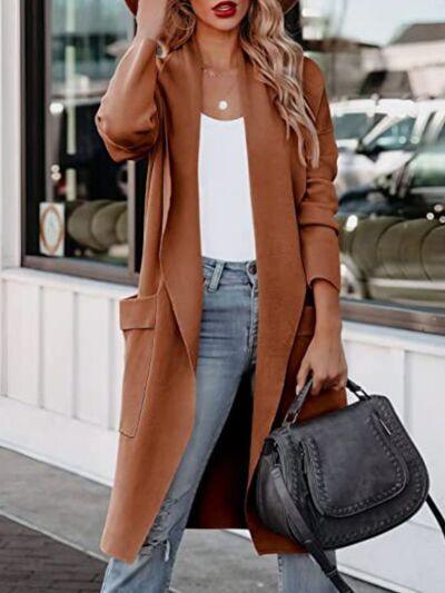 a woman wearing a brown coat and jeans