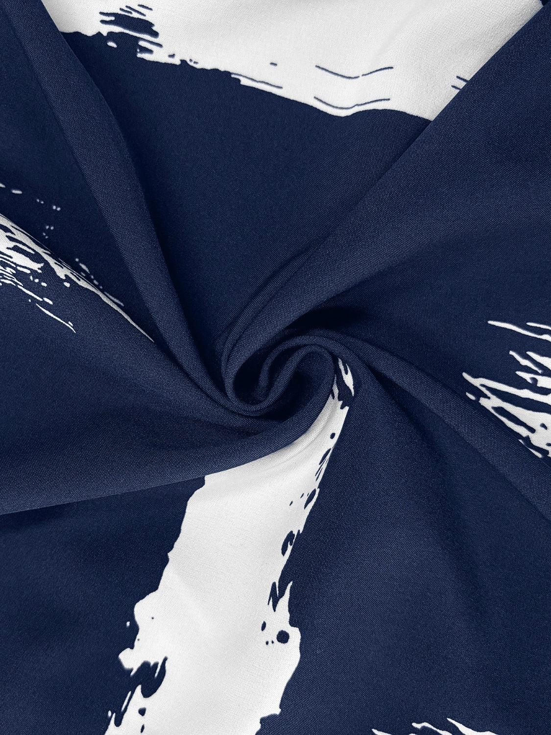 a blue and white fabric with white paint splatters