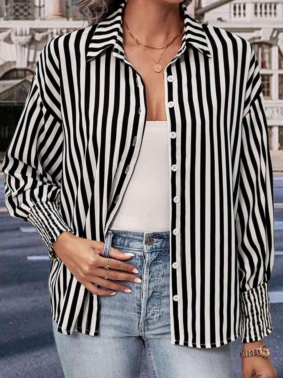 a woman wearing a black and white striped shirt