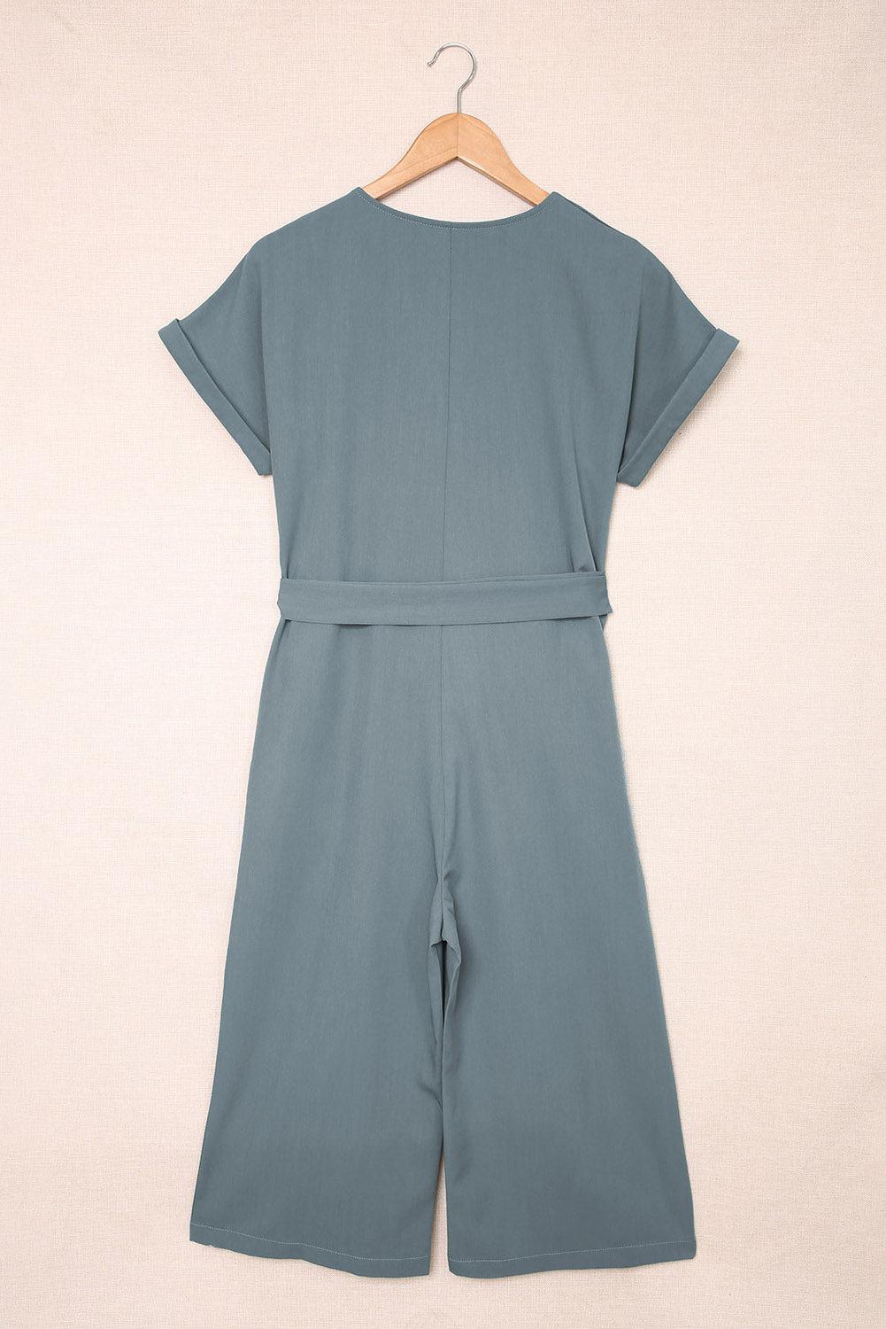 a baby boy's blue romper and short set on a hanger