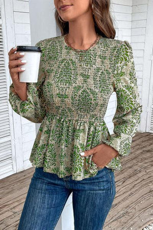 a woman holding a cup of coffee while standing on a porch