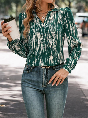 a woman wearing a green blouse and jeans