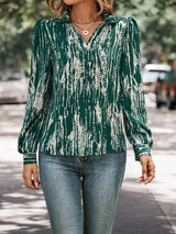 a woman walking down a street wearing a green shirt