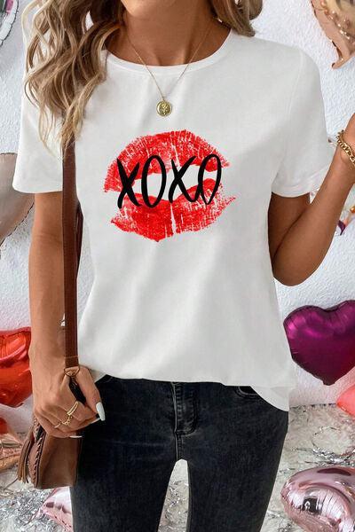 a woman wearing a white shirt with the word xox on it
