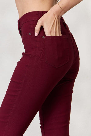 a close up of a person wearing red pants