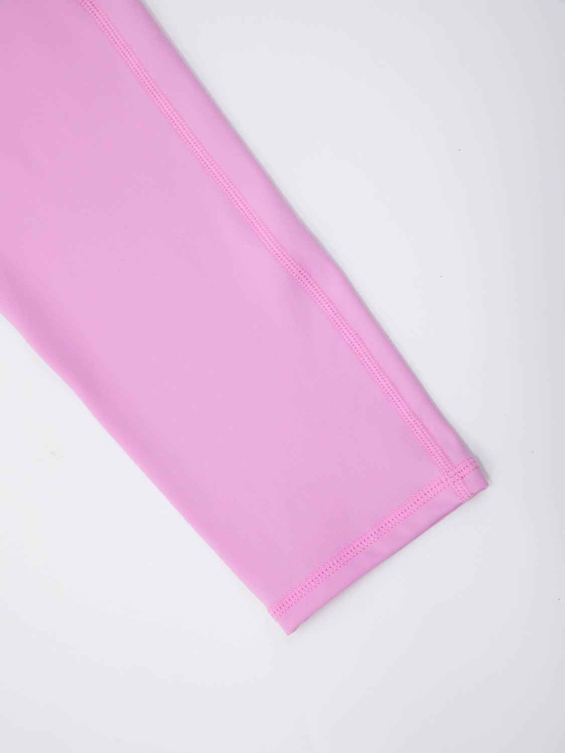 a close up of a pink cloth on a white surface
