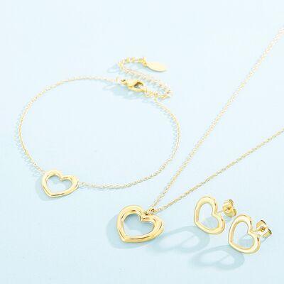 two gold necklaces with hearts on a blue background