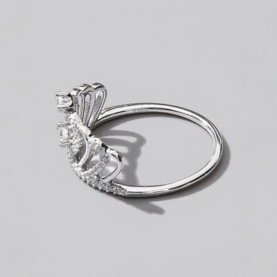 a diamond ring on a gray background