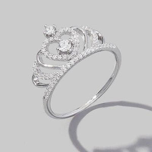 a diamond ring on a gray background