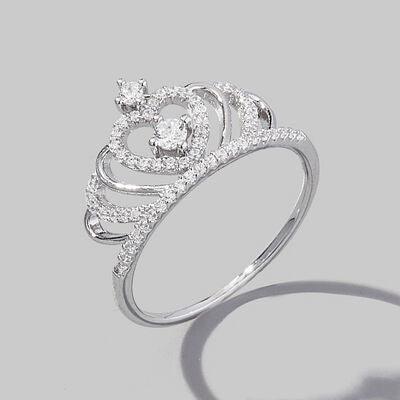 a diamond ring on a gray background