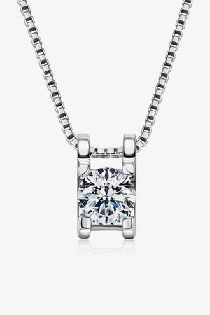 a necklace with a square cut diamond on a chain