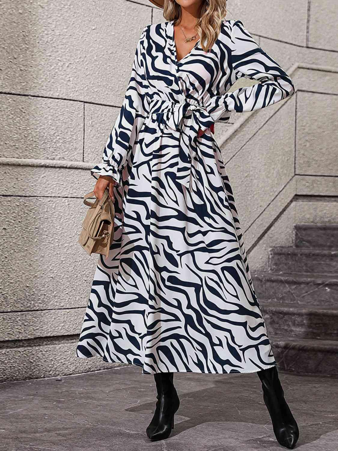 a woman in a zebra print dress