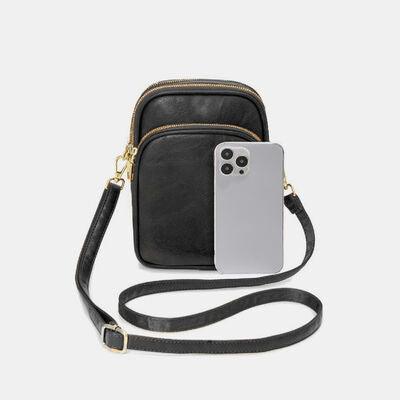 a black and white cell phone case with a strap