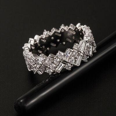 a diamond ring sitting on top of a black pen