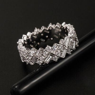a diamond ring sitting on top of a black pen