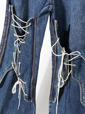 a pair of blue jeans with white laces on them