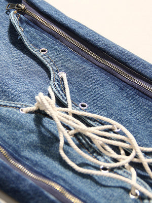 a pair of blue jeans with a white cord