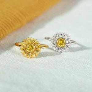 a pair of yellow and white rings sitting on top of a table