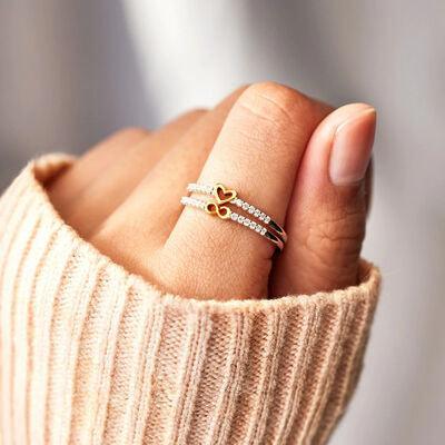 a woman's hand with a ring on it