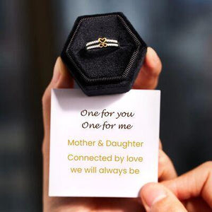 a person holding a card with a ring on it