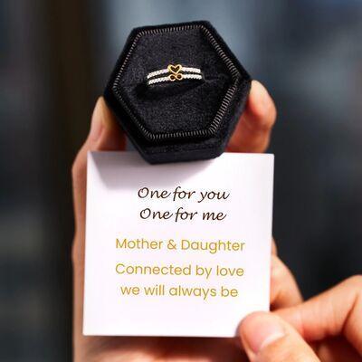 a person holding a card with a ring on it