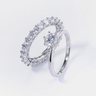 a white gold ring with a pear shaped diamond