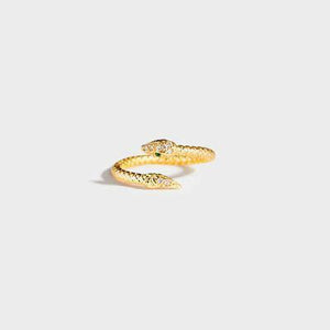 a gold snake ring with a green stone