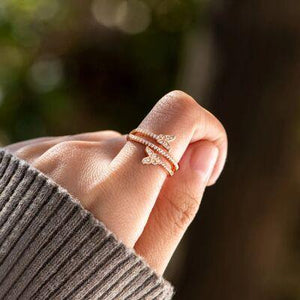 a woman's hand with a ring on it