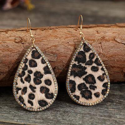 a pair of leopard print tear shaped earrings