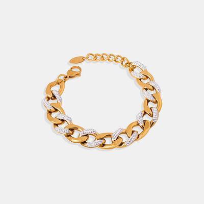 a gold chain bracelet with a diamond clasp