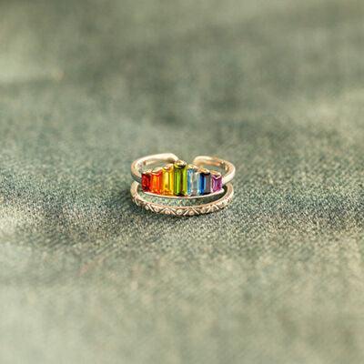 a rainbow colored ring sitting on top of a table