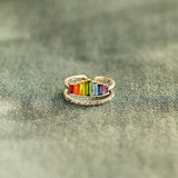 a rainbow colored ring sitting on top of a table