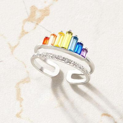 a rainbow colored ring sitting on top of a table