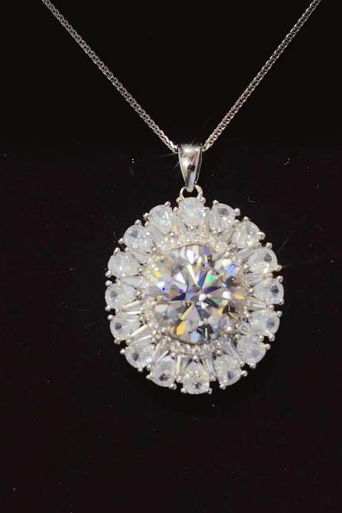 a diamond pendant on a black background