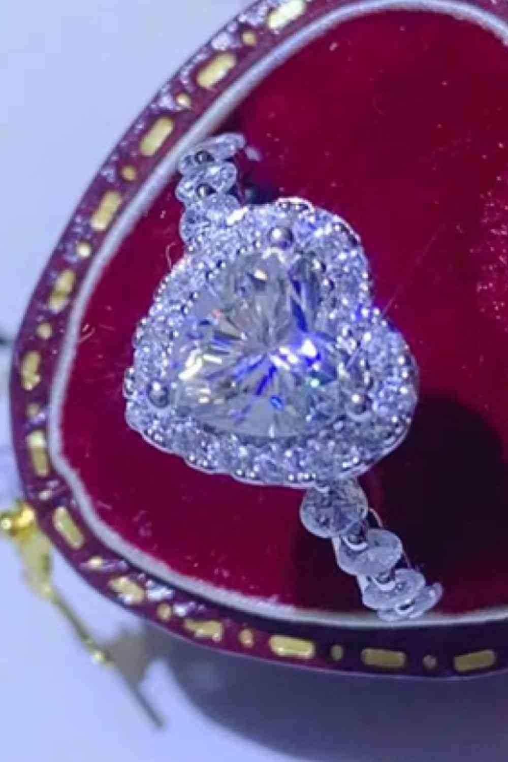 a diamond ring in a red velvet case