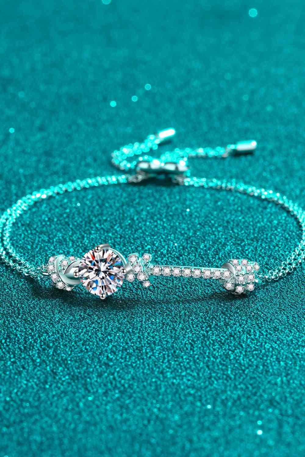 a diamond bracelet on a turquoise background