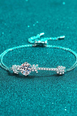 a diamond bracelet on a turquoise background