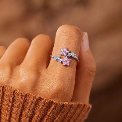 a woman's hand with a ring on it