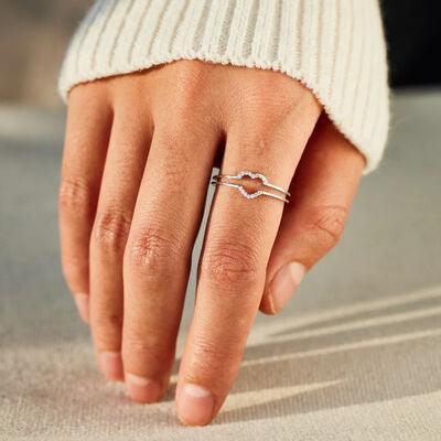 a woman's hand with a ring on it