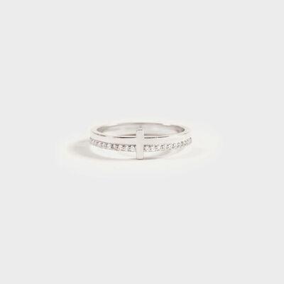 a white gold ring with a cross on it