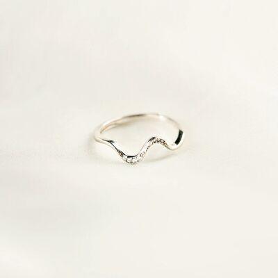 a silver ring with a wave design on it